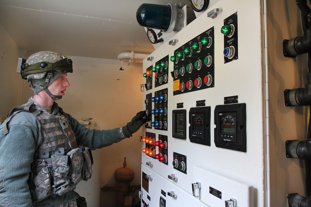 Army Spc. Ryan Canfield operates a reverse osmosis water purification unit at the Brindle Lake training area on Joint Base McGuire-Dix-Lakehurst, N.J., March 6, 2016. Army photo by Spc. Michael McDevitt