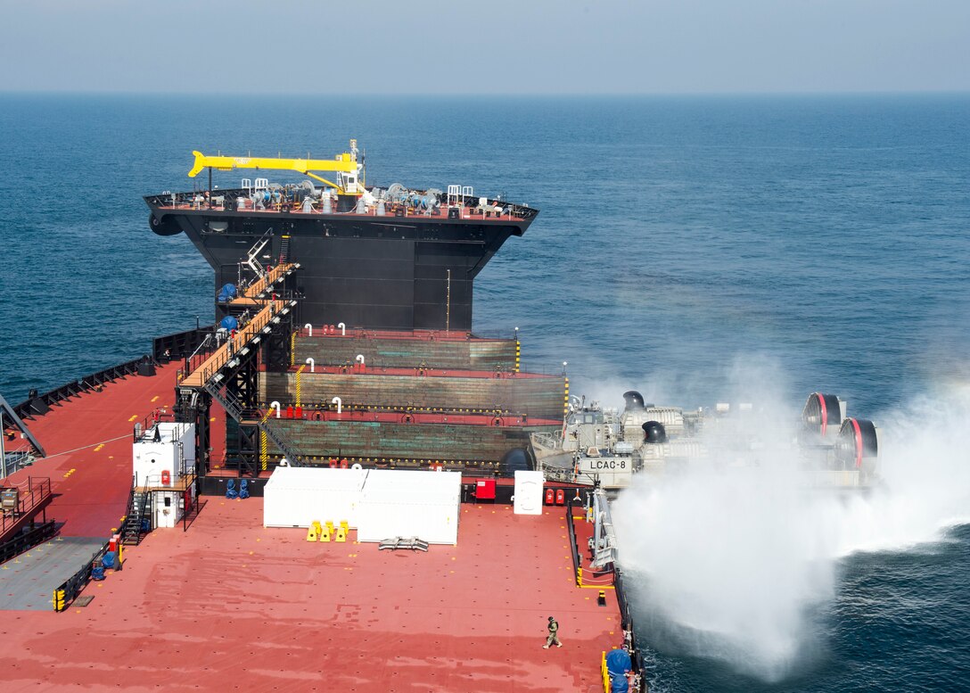 160317-N-IK388-011 EAST SEA (Mar. 17, 2016) – A landing craft air cushion (LCAC) attached to Naval Beach Unit 7 embarks expeditionary transfer dock ship USNS Montford Point (T-ESD1) after departing amphibious assault ship USS Bonhomme Richard (LHD 6) to conduct a seabasing demonstration in support of Exercise Ssang Yong 2016 (SY16). Bonhomme Richard is the flagship of the Bonhomme Richard Expeditionary Strike Group and is participating in SY16, a biennial combined amphibious exercise conducted by forward-deployed forces with the Republic of Korea Navy and Marine Corps, Australian Army and Royal New Zealand Army Forces in order to strengthen interoperability and working relationships across a wide range of military operations from disaster relief to complex expeditionary operations.  (U.S. Navy photo by Mass Communication Specialist 2nd Class Stacy M. Atkins Ricks/Released)