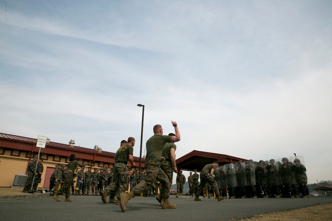 Marines with Company C, 3d Law Enforcement Battalion, demonstrate riot control techniques for Republic of Korea Marines, March 17, 2016, at Camp Mujuk, South Korea. Company C is participating in Ssang Yong 16, a biennial combined amphibious exercise conducted by forward-deployed U.S. forces with the Republic of Korea Navy and Marine Corps, Australian Army and Royal New Zealand Army Forces in order to strengthen our interoperability and working relationships across a wide range of military operations - from disaster relief to complex expeditionary operations.