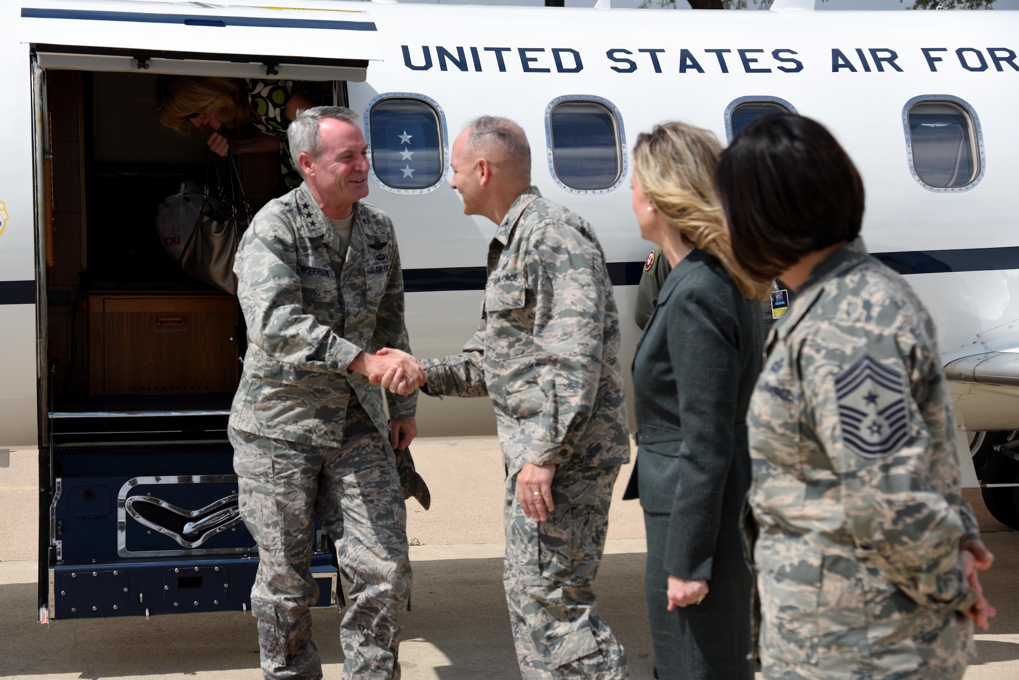 U.S. Air Force Lt. Gen. Darryl L. Roberson, commander of Air Education and Training Command, is greeted by Col. Michael L. Downs, 17th Training Wing commander, Leah Downs, , and Chief Master Sgt. JoAnne S. Bass, 17th TRW command chief, at the San Angelo Regional Airport, San Angelo, Texas, March 17, 2016. Roberson’s visit to Goodfellow is his first since taking command. (U.S. Air Force photo by Senior Airman Joshua Edwards/Released)