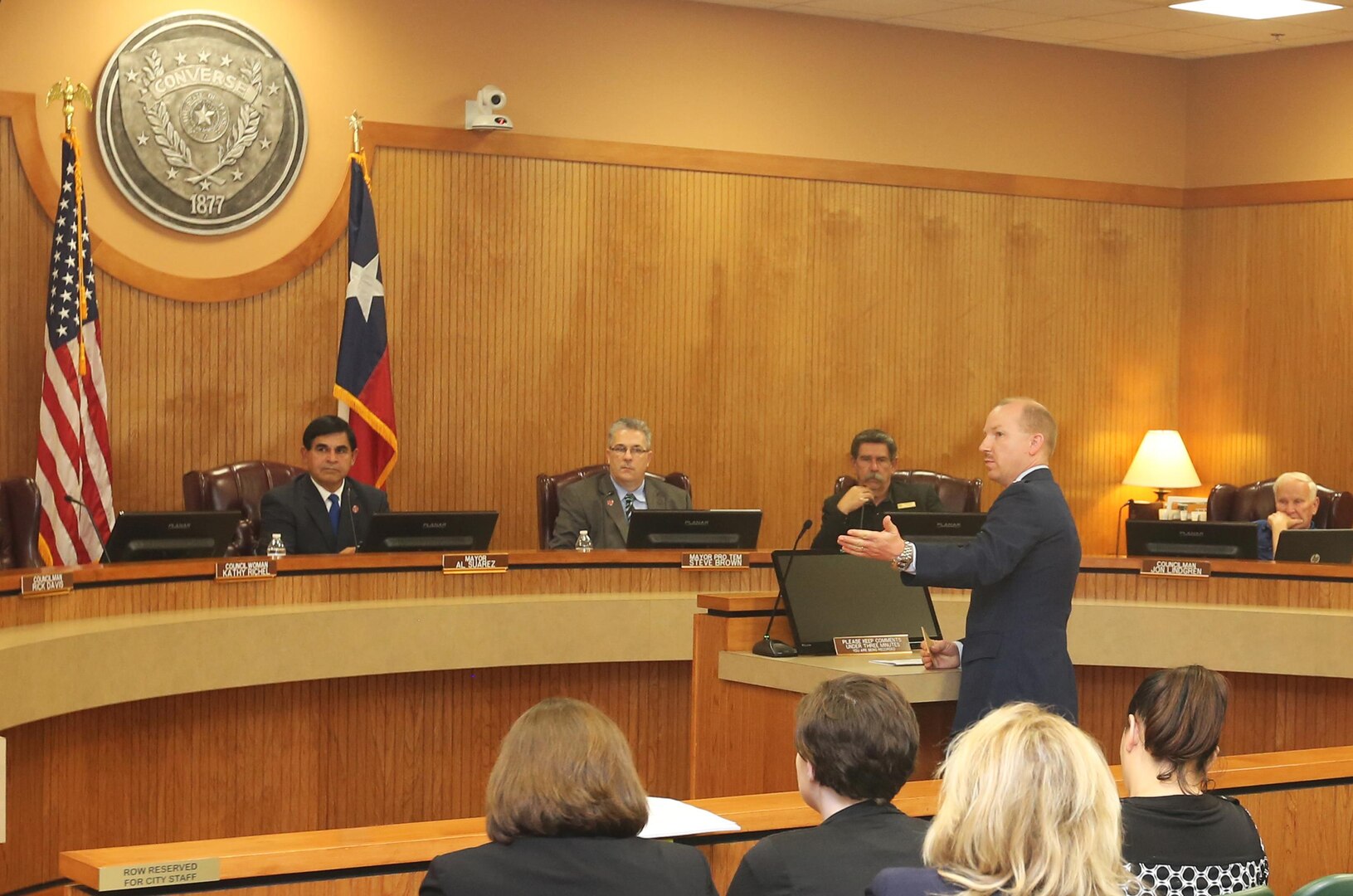 Lt. Col. Emil Bliss, 12th Flying Training Wing Community Initiatives director, addresses the Converse City Council about the Joint Land Use Study during a public meeting March 15, 2016. The city council unanimously voted to adopt the study, ensuring joint development planning and compatible land use between the city and Joint Base San Antonio-Randolph. 