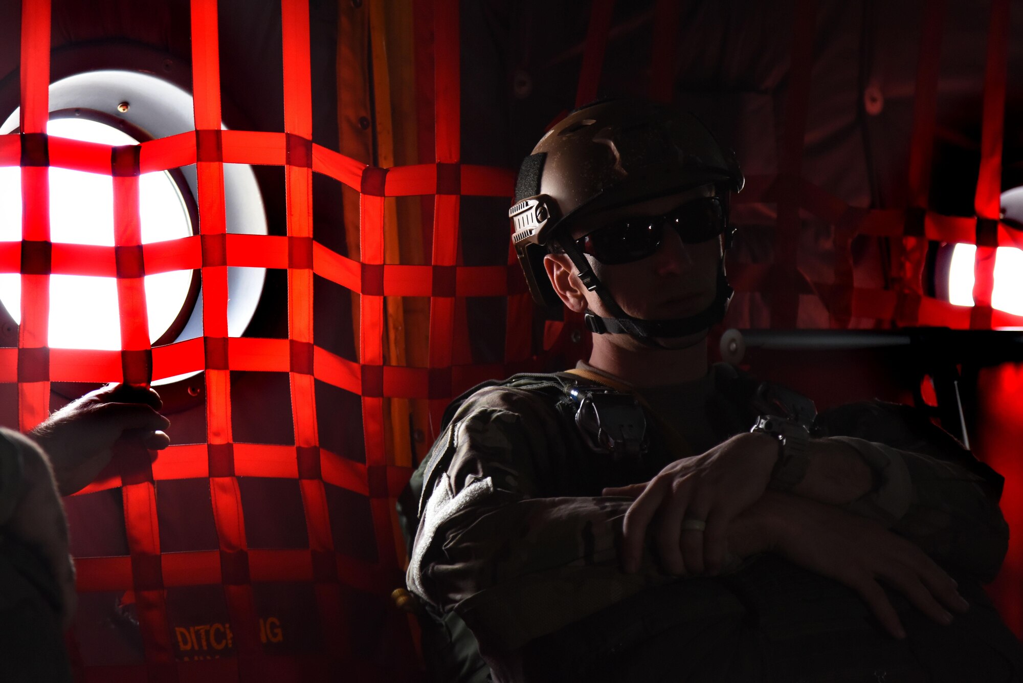 U.S. Air Force Tech. Sgt. Josh Embry, a 36th Rescue Squadron survival, evasion, resistance and escape specialist, relaxes prior to jumping from a C-130 Hercules March 3, 2016, during Red Flag 16-2 near Nellis Air Force Base, Nevada.  Embry and other SERE specialists completed several jumps throughout the exercise to prepare for combatant commander requirements around the world. (U.S. Air Force photo/Staff Sgt. Chuck Broadway)