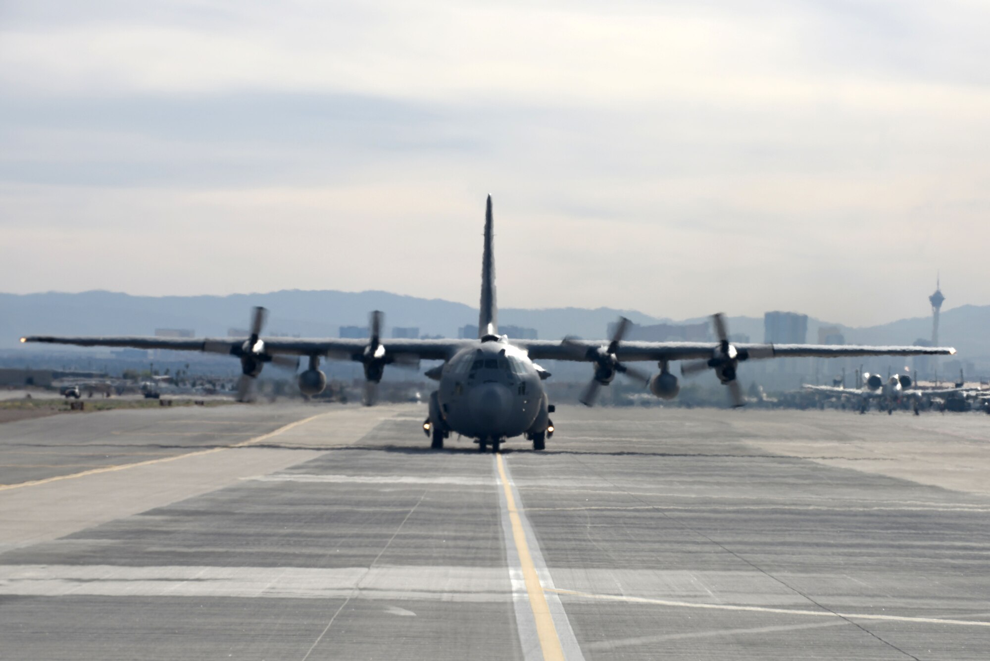 A C-130 Hercules, assigned to the 700 Airlift Wing at Dobbins Air Reserve Base, Georgia, taxies on the flightline during Red Flag 16-2 March 3, 2016, at Nellis Air Force Base, Nevada. Red Flag was established in 1975 as one of the initiatives directed by General Robert J. Dixon, then commander of Tactical Air Command, to better prepare U.S. and allied forces for combat. During the two week exercise, units from around the world work on integration to better themselves for future operations. (U.S. Air Force photo by Staff Sgt. Michael Charles)