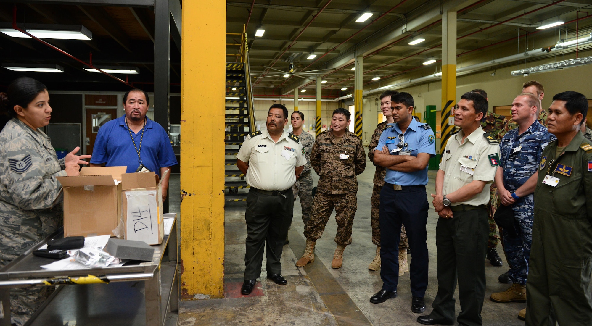 Tech. Sgt. Roxana Aguilar, 36th Mobility Response Squadron materiel management NCO in charge, left, discusses supply chain management operations with military logistics and maintenance experts during Pacific Agility 16-1, March 17, 2016, at Andersen Air Force Base, Guam. Pacific Agility is a multilateral U.S. Pacific Agility is a Pacific Air Forces-led engagement focusing on a series of logistics subject-matter expert exchanges designed to increase partner capabilities, military relations and regional stability for the Indo-Asia-Pacific region. The four-day program focused on various topics such as logistics, aircraft maintenance, air/ground transportation, humanitarian assistance/disaster relief and contingency operations. (U.S. Air Force photo by Airman 1st Class Arielle Vasquez/Released)