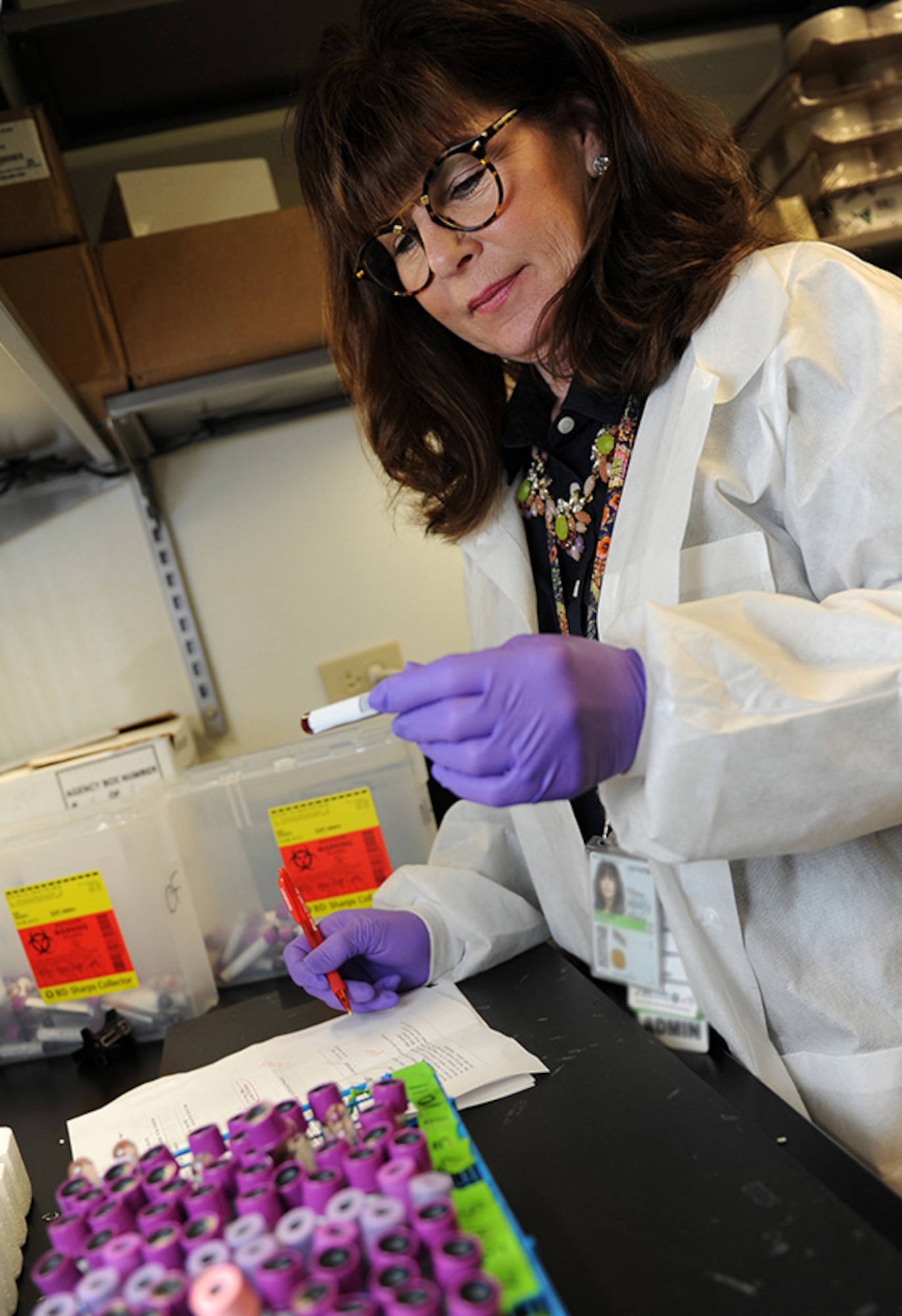 Ilan Prichard, 81st Medical Operations Squadron administration clerk, verifies sample identification with the testing requests at the 81st Medical Group’s genetics center Mar. 16, 2016, Keesler Air Force Base, Miss. The Air Force Medical Genetics Center is the only laboratory of its kind in the entire Defense Department. Made up of the cytogenetics and molecular genetics labs, the center is focused on providing clinical and laboratory diagnostic services to support all DOD facilities worldwide. (U.S. Air Force photo by Kemberly Groue)