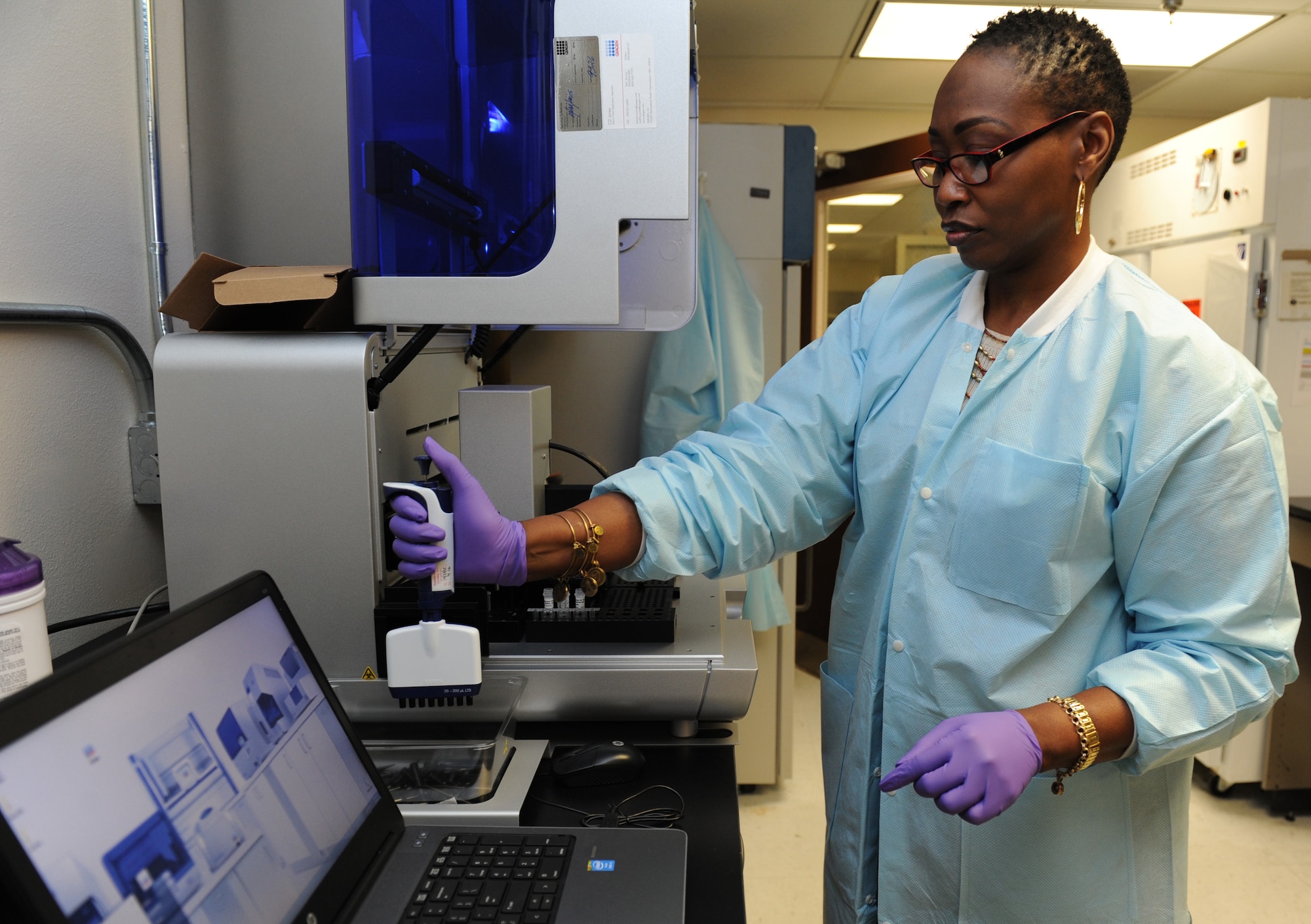 DeShannon Hall, 81st Medical Operations Squadron molecular technologist, uses a robotic sample prep handler at the 81st Medical Group’s genetics center Mar. 16, 2016, Keesler Air Force Base, Miss. The Air Force Medical Genetics Center is the only laboratory of its kind in the entire Defense Department. Made up of the cytogenetics and molecular genetics labs, the center is focused on providing clinical and laboratory diagnostic services to support all DOD facilities worldwide. (U.S. Air Force photo by Kemberly Groue)