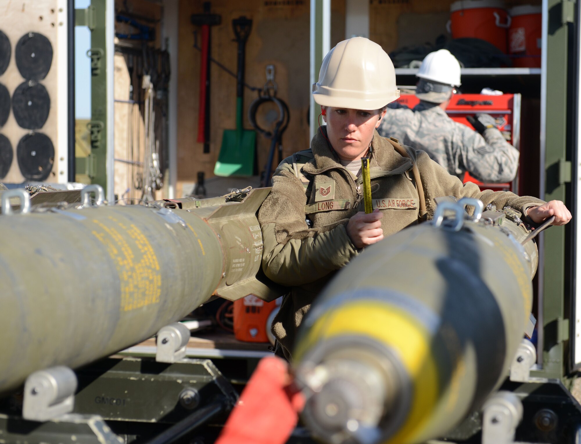 Tech. Sgt. Ashley Long, 9th Munitions Squadron combat advisor, inspects munitions March 15, 2016, at Beale Air Force Base, California. Combat advisors are experienced munitions technicians who advise munitions students attending the Air Force Combat Ammunition Center. (U.S. Air Force photo by Senior Airman Bobby Cummings)