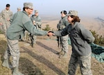 Gen. Lori J. Robinson, Pacific Air Forces commander, shakes hands with Senior Airman Kimberlee Kutt, 8th Force Support Squadron fitness center journeyman during her visit to Kunsan Air Base, Republic of Korea, March 17, 2016. Robinson had the opportunity to see firsthand how Kunsan Airmen contribute to deterring aggression on the Korean Peninsula during her visit to Kunsan.