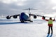 A C-17 Globemaster III aircraft out of Joint Base Lewis-McChord, Washington, is marshaled on Pegasus Runway, Antarctica during the 2015 Operation Deep Freeze Season. The 446th Airlift 