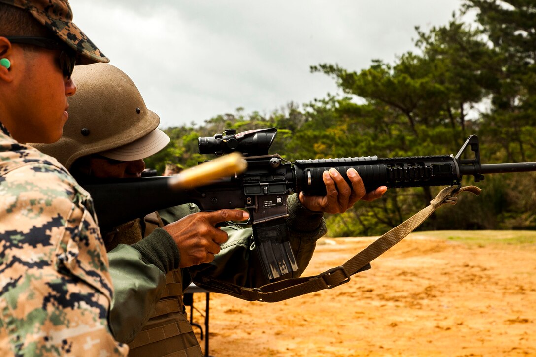 David Lucar fires an M16-A4 service rifle at Camp Schwab, Okinawa, Japan March 18, 2016. Lucar was able to experience dynamic facets of life in the Marine Corps. This included an Amphibious Assault Vehicle raid, firing the M9 service pistol, firing the M240B medium machine gun, wearing flak jackets with Kevlar helmets and eating packaged military rations. Lucar is an Okinawa resident and the uncle of a Marine with Combat Assault Battalion, 3rd Marine Division, III Marine Expeditionary Force. (U.S. Marine Corps photo by Pfc. Nelson B. Duenas /Released)