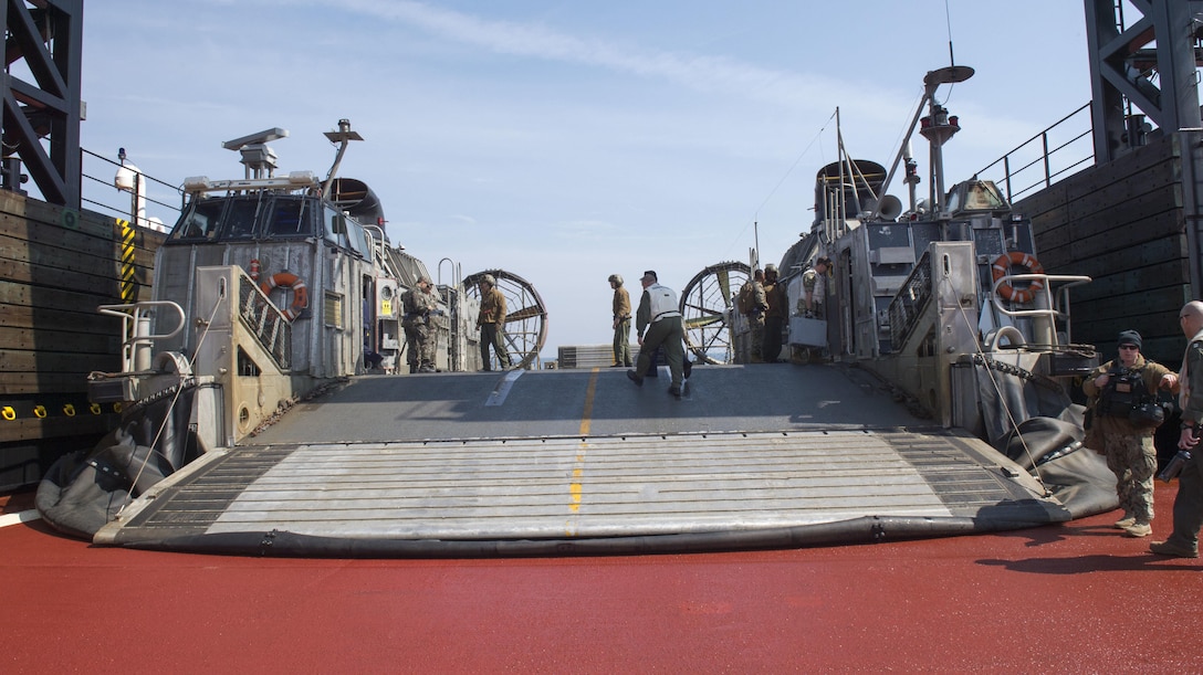 A landing craft air cushion (LCAC) attached to Naval Beach Group 7 embarks expeditionary transfer dock ship USNS Montford Point (T-ESD 1) after departing amphibious assault ship USS Bonhomme Richard (LHD 6) to perform landing drills. Bonhomme Richard is the flagship of the Bonhomme Richard Expeditionary Strike Group and is participating in Exercise Ssang Yong 2016, a biennial combined amphibious exercise conducted by forward-deployed forces with the Republic of Korea Navy and Marine Corps, Australian Army and Royal New Zealand Army Forces in order to strengthen interoperability and working relationships across a wide range of military operations from disaster relief to complex expeditionary operations.  (U.S. Navy photo by Mass Communication Specialist 2nd Class Stacy M. Atkins Ricks/Released)