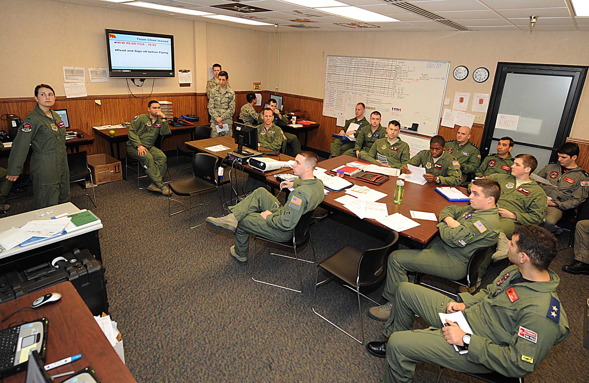 First Lt. Adria Trgovich, 350th Air Refueling Squadron navigator, briefs aircrews from the U.S. and Turkish air forces before their flights, March 8, 2016, at Nellis Air Force Base, Nev. The crews flew the first-ever joint KC-135 Stratotanker formation flights during Red Flag 16-2. (U.S. Air Force photo/Senior Airman David Bernal Del Agua)