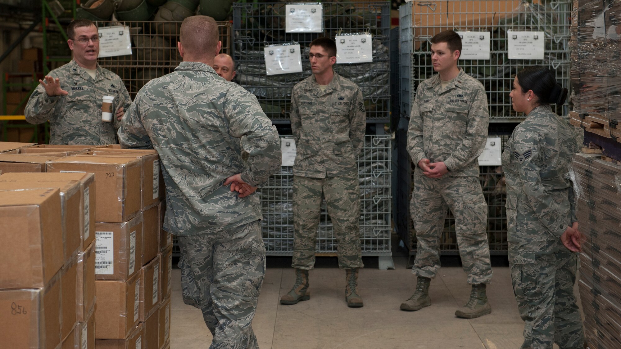 Col. Michael Grismer, 436th Airlift Wing commander, speaks with 436th Logistics Readiness Squadron Airmen March 16th, 2016, inside the installation deployment readiness center on Dover Air Force Base, Del. Grismer visits with units in his command as part of his Leadership By Walking Around weekly initiative. (U.S. Air Force photo/Senior Airman Zachary Cacicia)