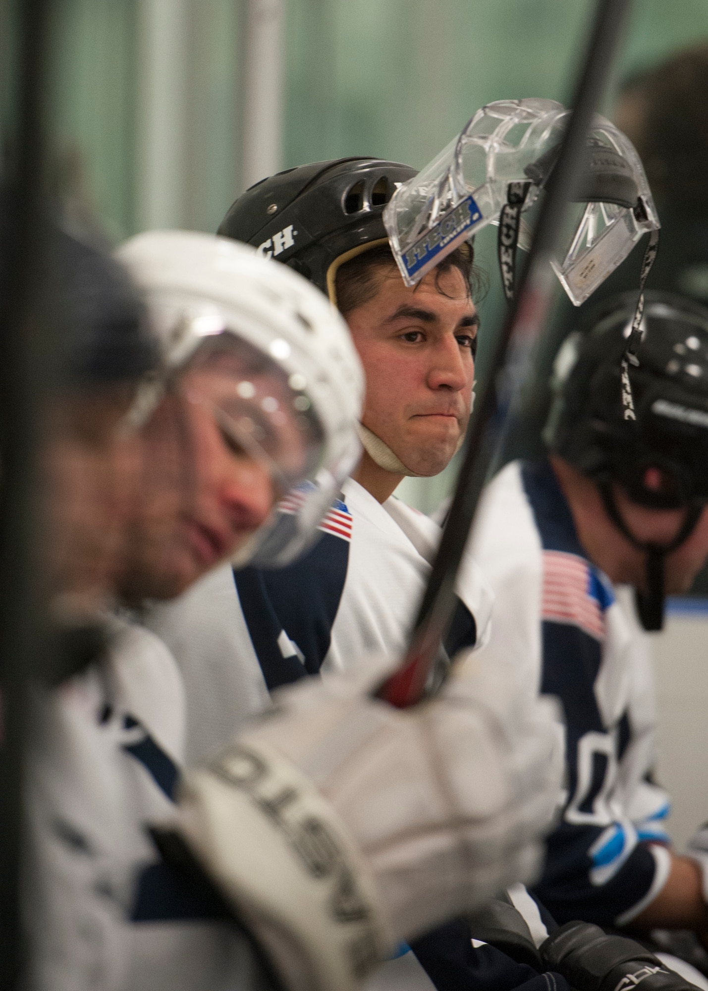 Elias Carreon, Dover Eagles forward, watches play while sitting on his team’s bench during a charity hockey game March 13, 2016, at the Centre Ice Rink in Harrington, Del. The Fraternal Order of Police Lodge 15 hockey team defeated the Eagles, 9-7. (U.S. Air Force photo/Senior Airman Zachary Cacicia)