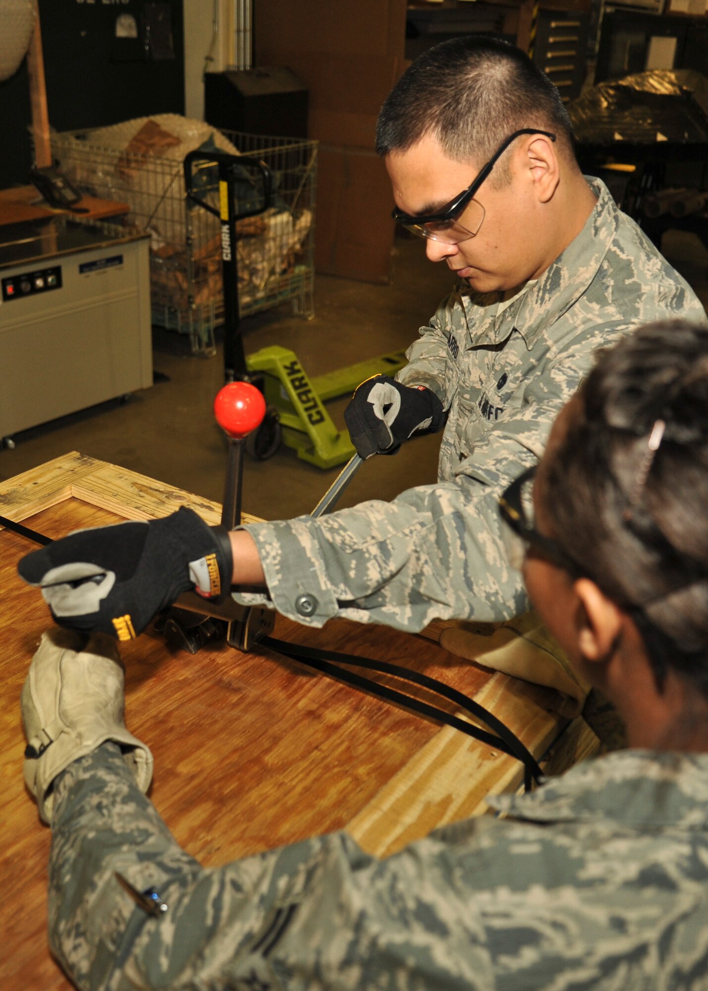 Senior Airman Johnraphael Navarro, 92nd Logistics Readiness Squadron traffic management journeyman, closes up a crate March 18, 2016, at Fairchild Air Force Base, Wash. The Traffic Management Office receives parts ranging from a small bolt to larger items like aircraft engines that have been ordered by an office on base. They will also receive assets from base supply that need to be shipped out, often having to build crates to ship them in. (U.S Air Force photo/Airman 1st Class Taylor Bourgeous)