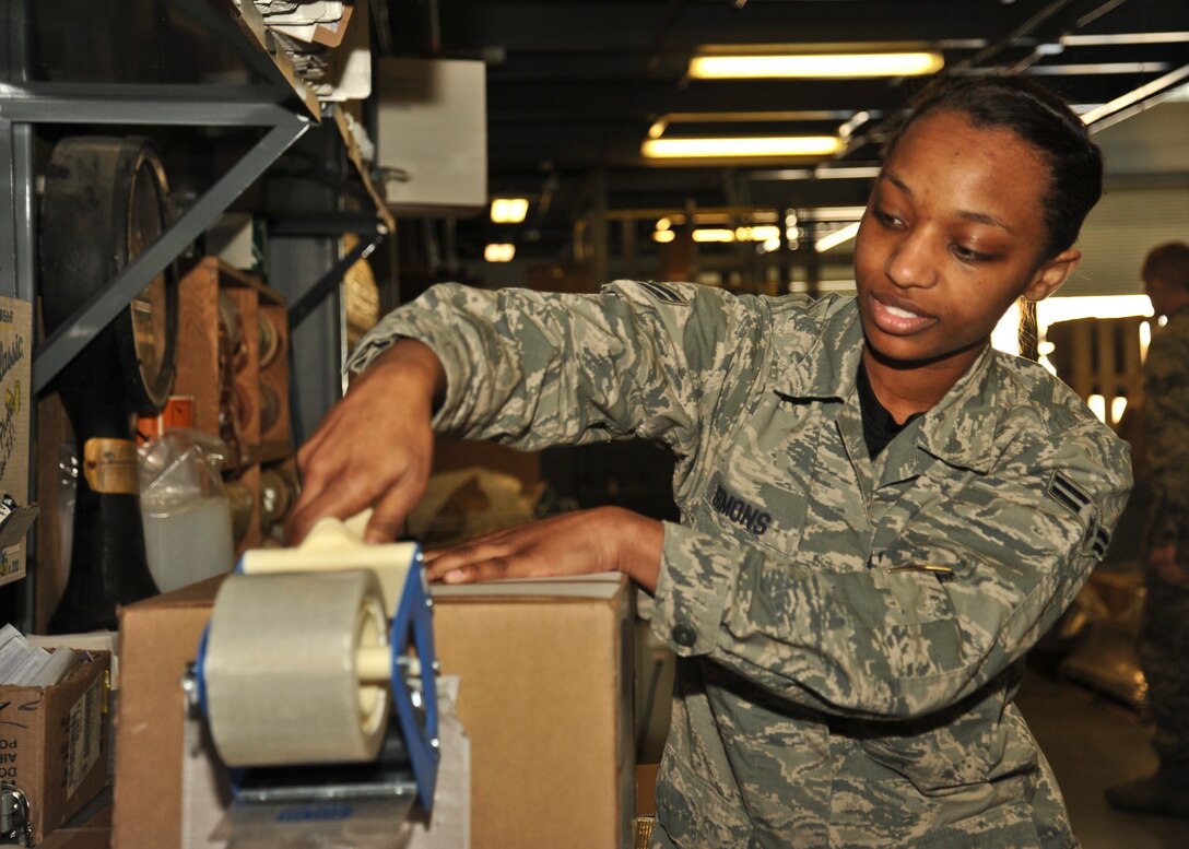 Airman 1st Class Patrice Simons, 92nd Logistics Readiness Squadron traffic management apprentice, packages a part to be shipped out on March 18, 2016, at Fairchild Air Force Base, Wash. The mission of the 92nd Logistics Readiness Squadron Traffic Management Office is to ensure the parts they receive are in serviceable condition and delivered to the customer in a timely matter.  (U.S Air Force photo/Airman 1st Class Taylor Bourgeous)