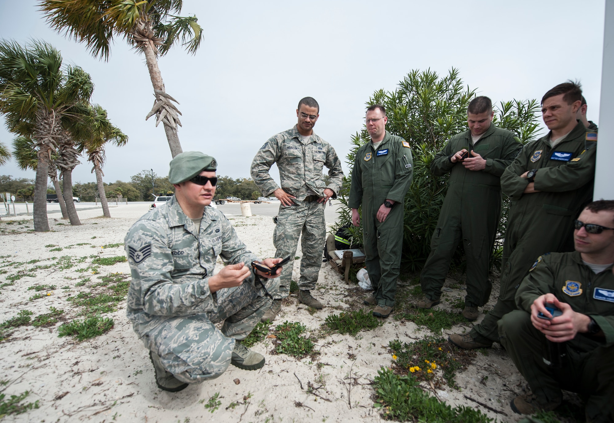 Staff Sgt. Jared Todd 305th Operation Support Squadron Search, Evasion,
Resistance and Escape NCO in charge of training operations and  Tech Sgt.
Isaac Houston, 305th OSS SERE section chief, goes through the contents of a
survival vest with aircrew members on the beach during Operational Readiness
Exercise 03-16 in Gulfport, Mississippi, March 9, 2016. 
SERE instructors ensure Airmen have the tools to survive on their own in any
environment, under any condition, should their aircraft go down.(Air Force photo/Senior Airman Lauren Pitts)
