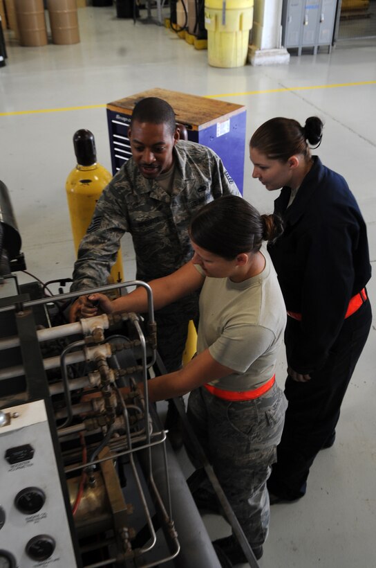 U.S. Air Force Tech. Sgt. Derrell Speights, 7th Equipment Maintenance Squadron Air Force ground equipment instructor, trains his Airmen April 1, 2015, at Dyess Air Force Base, Texas. Speights has an identical twin brother, who is also stationed at Dyess. In their 14 years of being active duty military, this is the first time they are stationed together at the same base. (U.S. Air Force photo by Senior Airman Shannon Hall/Released)