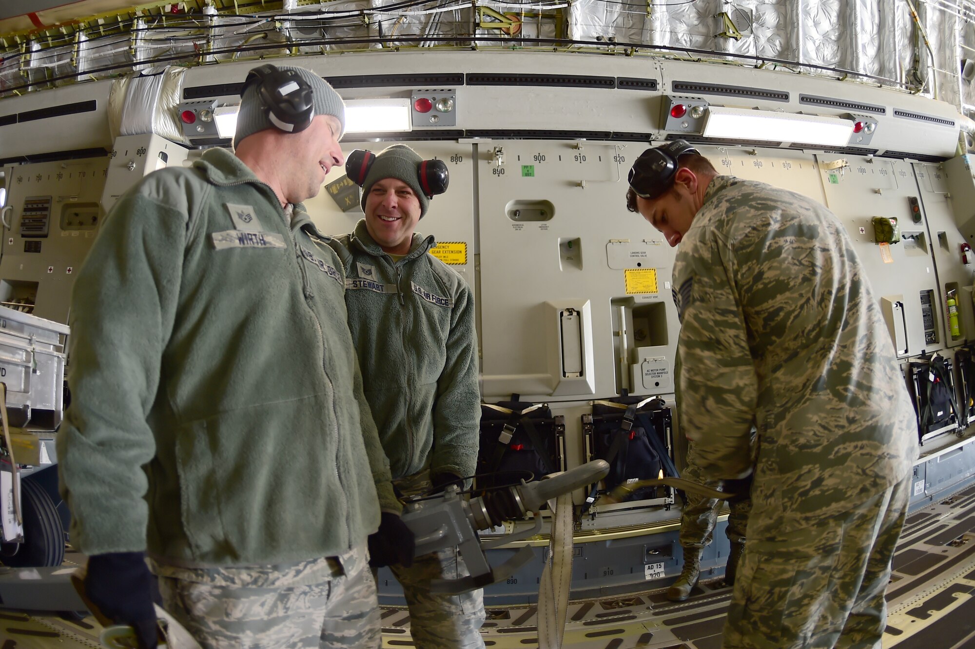 (left) Staff Sgt. Peter Wirth, 140th Maintenance Squadron equipment maintenance technician, Tech. Sgt. Alex Stewart, 140th MXS aerospace ground equipment mechanic and Tech Sgt. Garrett Fintel, 140th MXS munitions technician, assist in loading a C-17 Globemaster III March 15, 2016, on Buckley Air Force Base, Colo. The aircraft, assigned to the 172nd Airlift Wing, Jackson, Mississippi, supported the 140th Wing transport equipment to Tyndall AFB, Florida, for an exercise. (U.S. Air Force photo by Airman 1st Class Luke W. Nowakowski/Released)