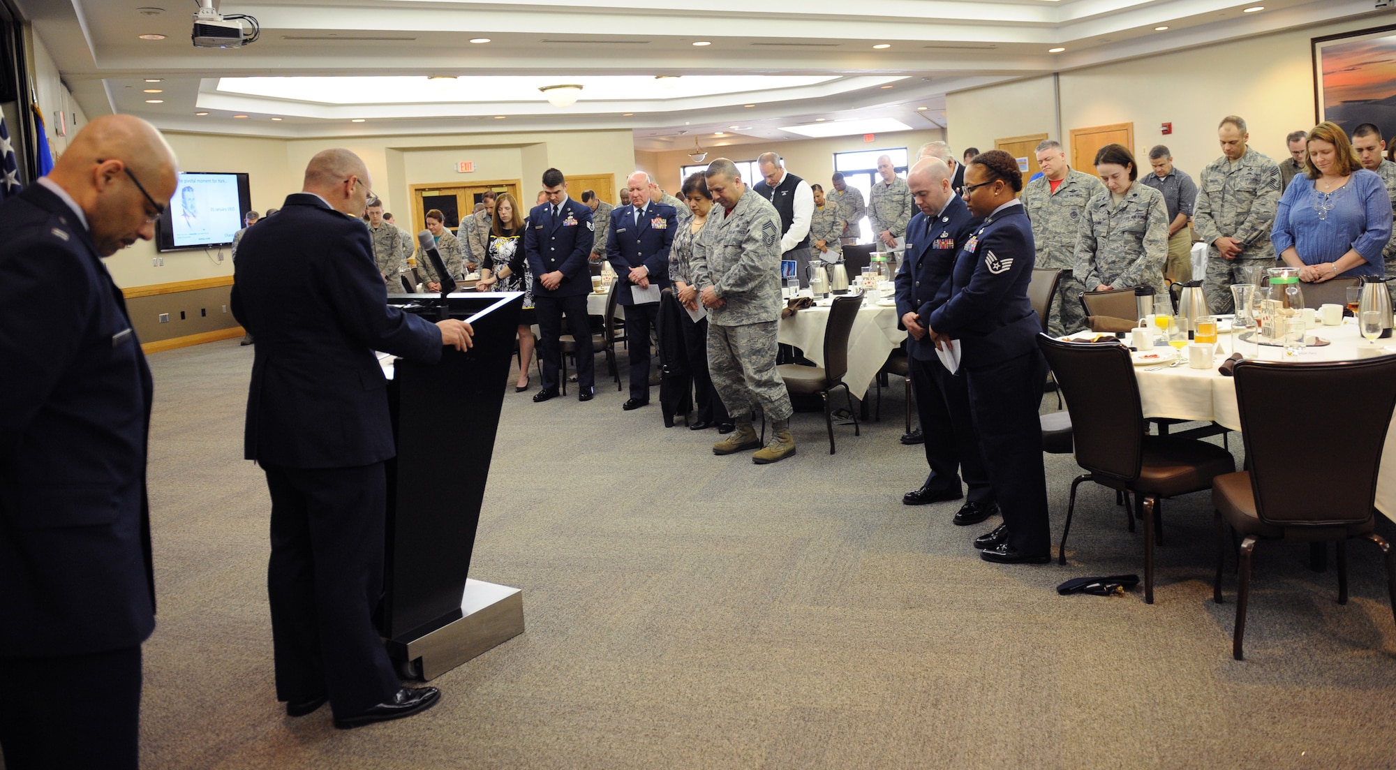 U.S. Air Force Chaplain (Maj.) David Leonard, a 509th Bomb Wing staff Chaplain, leads attendees of the National Prayer Breakfast in benediction at Whiteman Air Force Base, Mo., March 11, 2016. The National Prayer Breakfast is an annual event that started in 1953 by President Dwight D. Eisenhower in order to bring U.S. leadership together to recognize the moral and spiritual values the nation holds close. (U.S. Air Force photo by Airman 1st Class Michaela R. Slanchik)