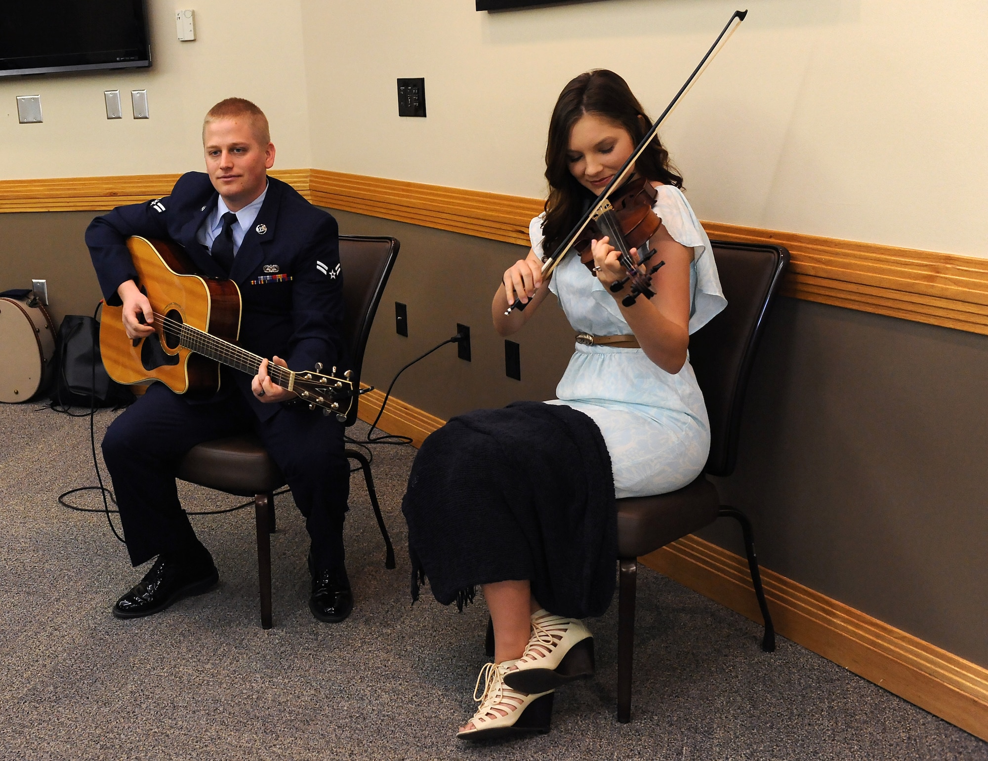 U.S. Air Force Airman 1st Class Michael Hodges, a 509th Bomb Wing staff paralegal, left, and his wife, Jill Hodges, play music before the National Prayer Breakfast at Whiteman Air Force Base, Mo., March 11, 2016. The National Prayer Breakfast is an annual event started in 1953 by President Dwight D. Eisenhower in order to recognize America’s moral and spiritual values. (U.S. Air Force photo by Airman 1st Class Michaela R. Slanchik)