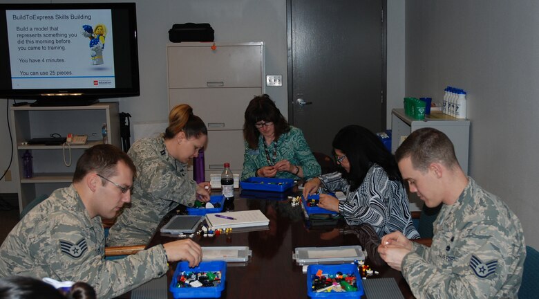 PETERSON AIR FORCE BASE, Colo. – Team Pete resiliency trainers gathered March 9, 2016 at Peterson Air Force Base to learn from LEGO Education’s global trainer how to use the bricks in promoting resiliency in their units. Using LEGO bricks helps people open up and share their stories. (U.S. Air Force photo by Dave Smith)