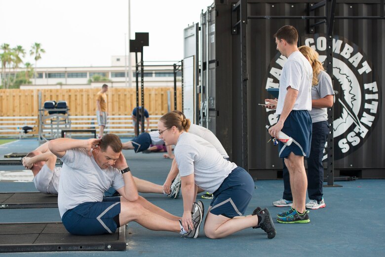 Airmen perform exercises during the 1946 Army Physical Fitness Test Challenge March 18, 2016, at the Patrick Air Force Base fitness center, Fla. The challenge served as a tribute to the first women who entered the military, which were required to complete the physical fitness test in order to join. (U.S. Air Force photo by Matthew Jurgens/released)
