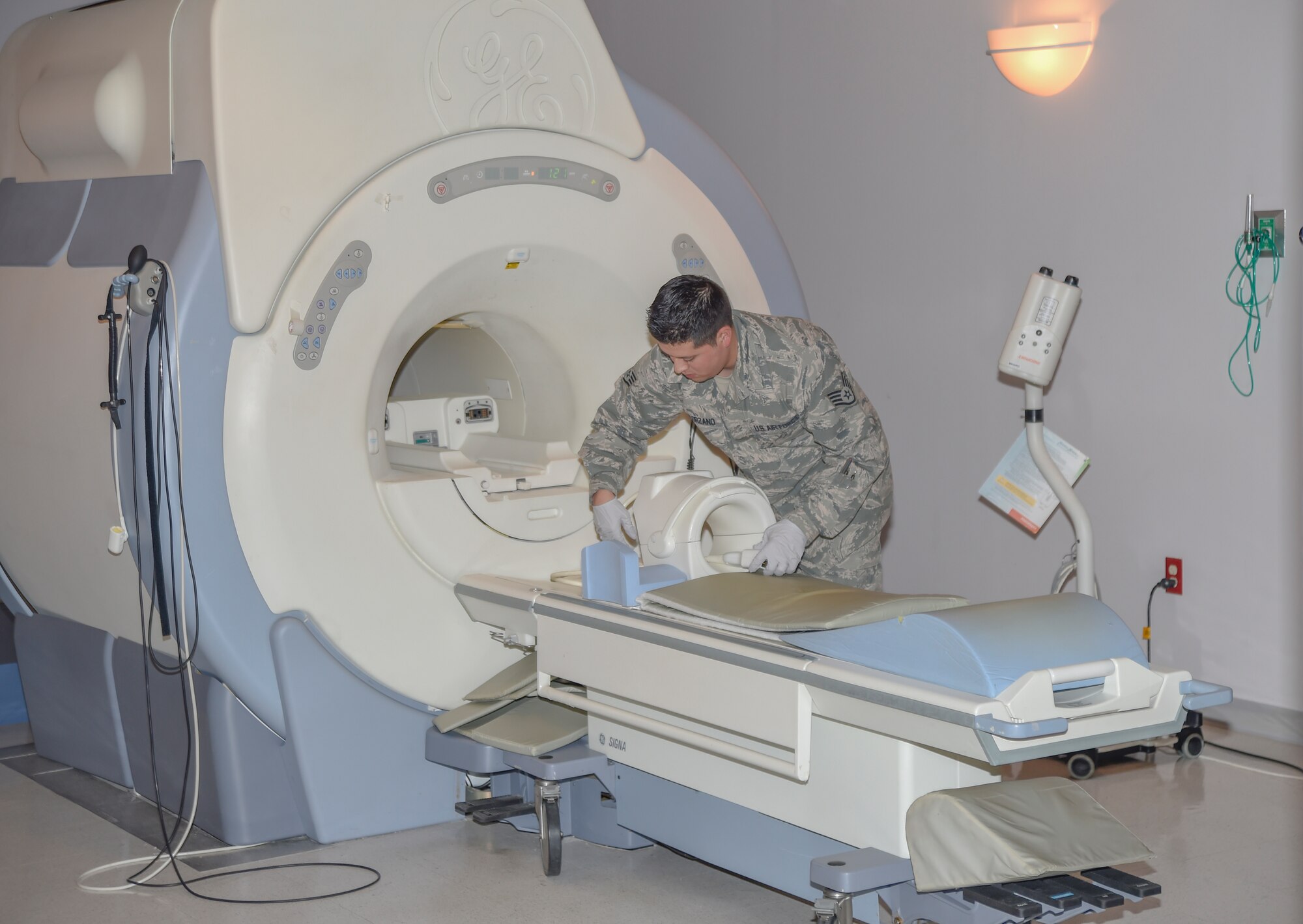 Staff Sgt. Adrian Solorzano, 779th Medical Group Magnetic Resonance Imaging section NCO in-charge, prepares the MRI machine for a patient at Malcolm Grow Medical Center on Joint Base Andrews, Md., March 17, 2016. MRIs can detect a variety of disorders, to include: brain deformities, injuries and musculoskeletal problems. (U.S. Air Force photo by Senior Airman Ryan J. Sonnier/RELEASED)
