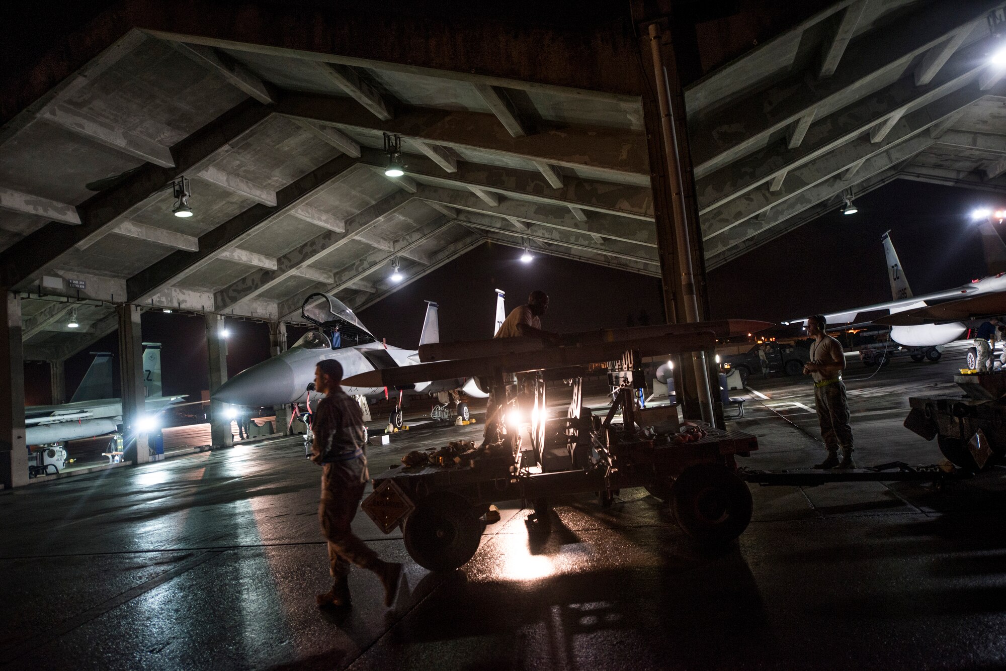 44th Aircraft Maintenance Unit Airmen scramble to prepare F-15 Eagles during a no-notice exercise March 18, 2016, at Kadena Air Base, Japan. Kadena Airmen train night and day to prepare for potential real-world scenarios to ensure peace and stability throughout the Indo-Asia-Pacific region. (U.S. Air Force photo by Senior Airman Omari Bernard)