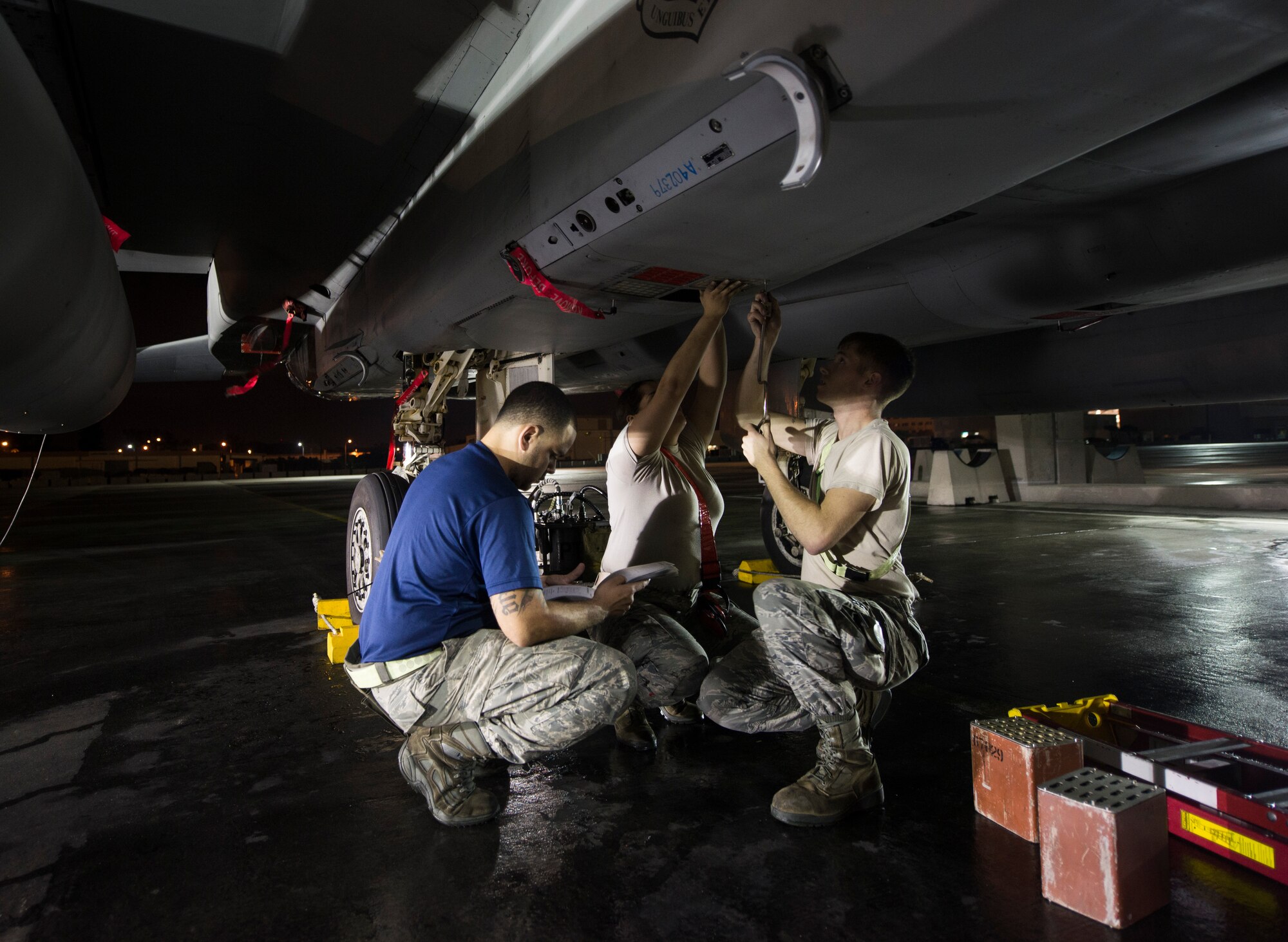 44th Aircraft Maintenance Unit Airmen equip an F-15 Eagle with flares in the early morning March 18, 2016, at Kadena Air Base, Japan. 18th Wing Airmen prepare with no-notice exercises to train like they would fight. (U.S. Air Force photo by Senior Airman Omari Bernard)
