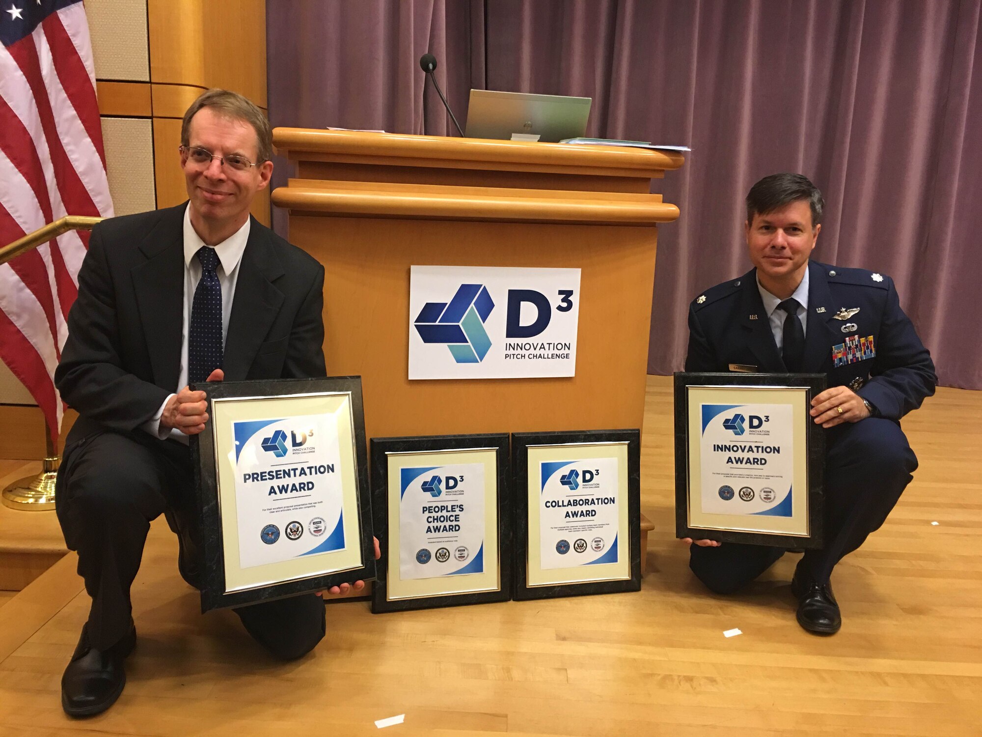 Dr. Paul Jaffe and Lt. Col. Peter Garretson pose with the awards their Space Solar Power D3 team won at inaugural Defense, Diplomacy and Development Innovation Summit Pitch Challenge, March 3 in Washington, D.C. The space solar power D3 team includes members of the Air University, the Naval Research Lab, Northrop Grumman, NASA, the Join Staff Logistics and Energy division, DARPA, the United States Army, and the Space Development Steering Committee. (Courtesy photo)