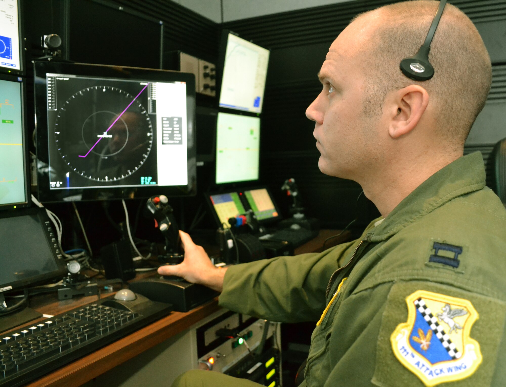 Capt. Christopher, a 103rd Attack Squadron pilot at Horsham Air Guard Station, Pa.,  operates an MQ-9 Reaper flight simulator at the FAA William J. Hughes Technical Center, Atlantic City, N.J., March 3, 2016. The Federal Aviation Administration selected eight 111th Attack Wing pilot volunteers from Horsham AGS for a study aimed at developing a Detect and Avoid display for unmanned aircraft systems. (U.S. Air National Guard photo by Tech. Sgt. Andria Allmond)