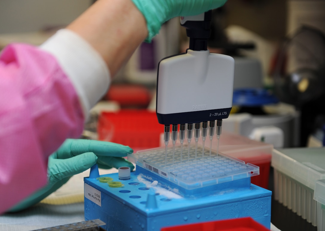 Kimberly Griffitt, 81st Medical Operations Squadron molecular technologist, uses a multi-channel pipetting technique to prepare patient DNA for testing at the 81st Medical Group’s genetics center Mar. 16, 2016, Keesler Air Force Base, Miss. The Air Force Medical Genetics Center is the only laboratory of its kind in the entire Defense Department. Made up of the cytogenetics and molecular genetics labs, the center is focused on providing clinical and laboratory diagnostic services to support all DOD facilities worldwide. (U.S. Air Force photo by Kemberly Groue)