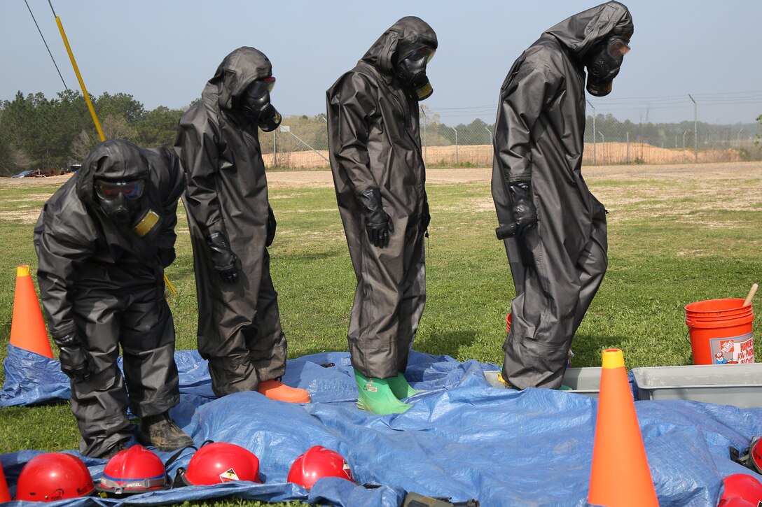 Soldiers perform self-decontamination procedures during a chemical, biological, radiological and nuclear defense training exercise at the Joint Readiness Training Center on Fort Polk, La., March 15, 2016. The soldiers are assigned to the 21st Chemical Company. Army photo by Spc. Ashley Marble
