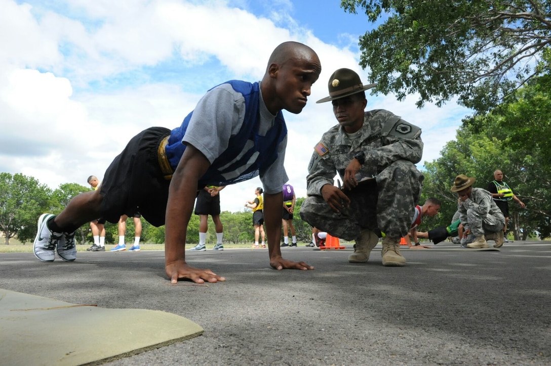 Private 1st Class Andrew I. Rosser, 210th Regional Support Group, performs pushups during the Army Physical Fitness Test portion of the Best Warrior Competition at Camp Santiago, Puerto Rico, March 14.