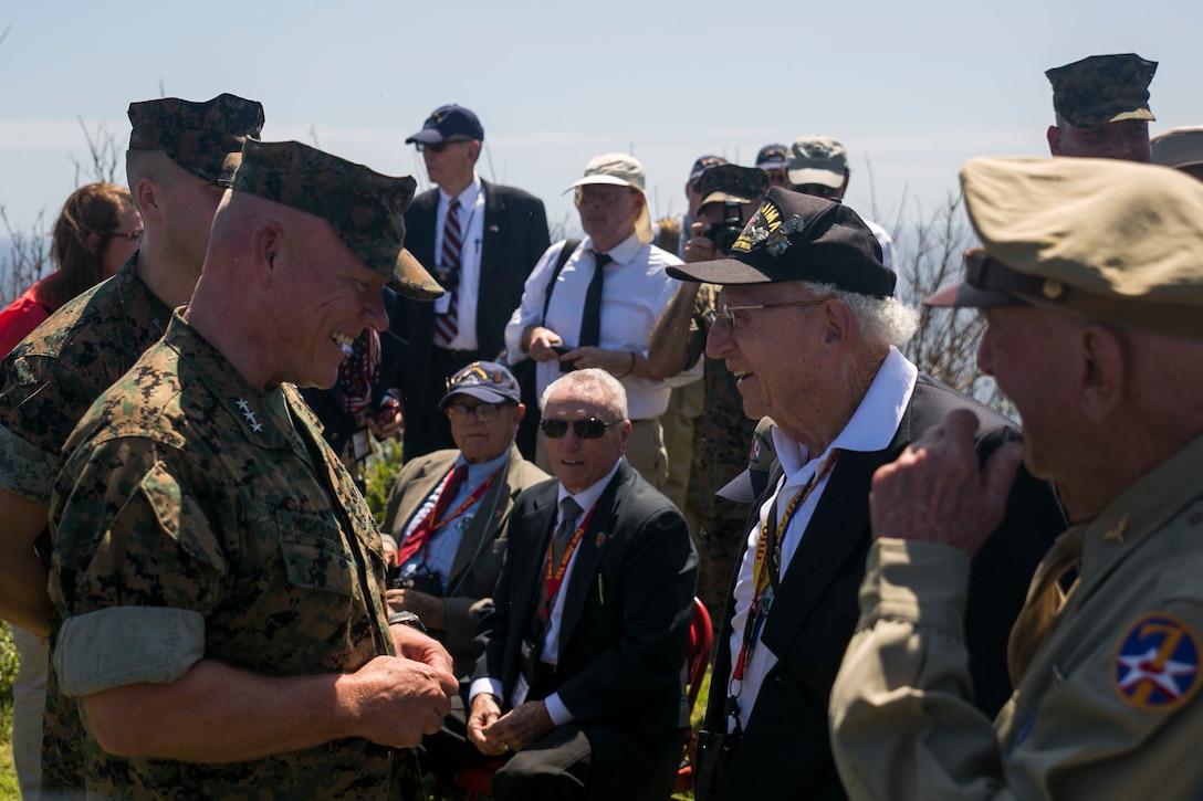 Lt. Gen. Lawrence Nicholson talks with U.S. Navy Seabee Jack Lazere, a veteran of the Battle of Iwo Jima, before 71st Reunion of Honor Ceremony March 19 at Iwo To, Japan. The ceremony gathers surviving veterans, their families and active duty service members of both nations to reflect on 71 years of peace and prosperity between the U.S. and Japan alliance. Nicholson, native of Toronto, Canada, is the Commanding General of III Marine Expeditionary Force. 