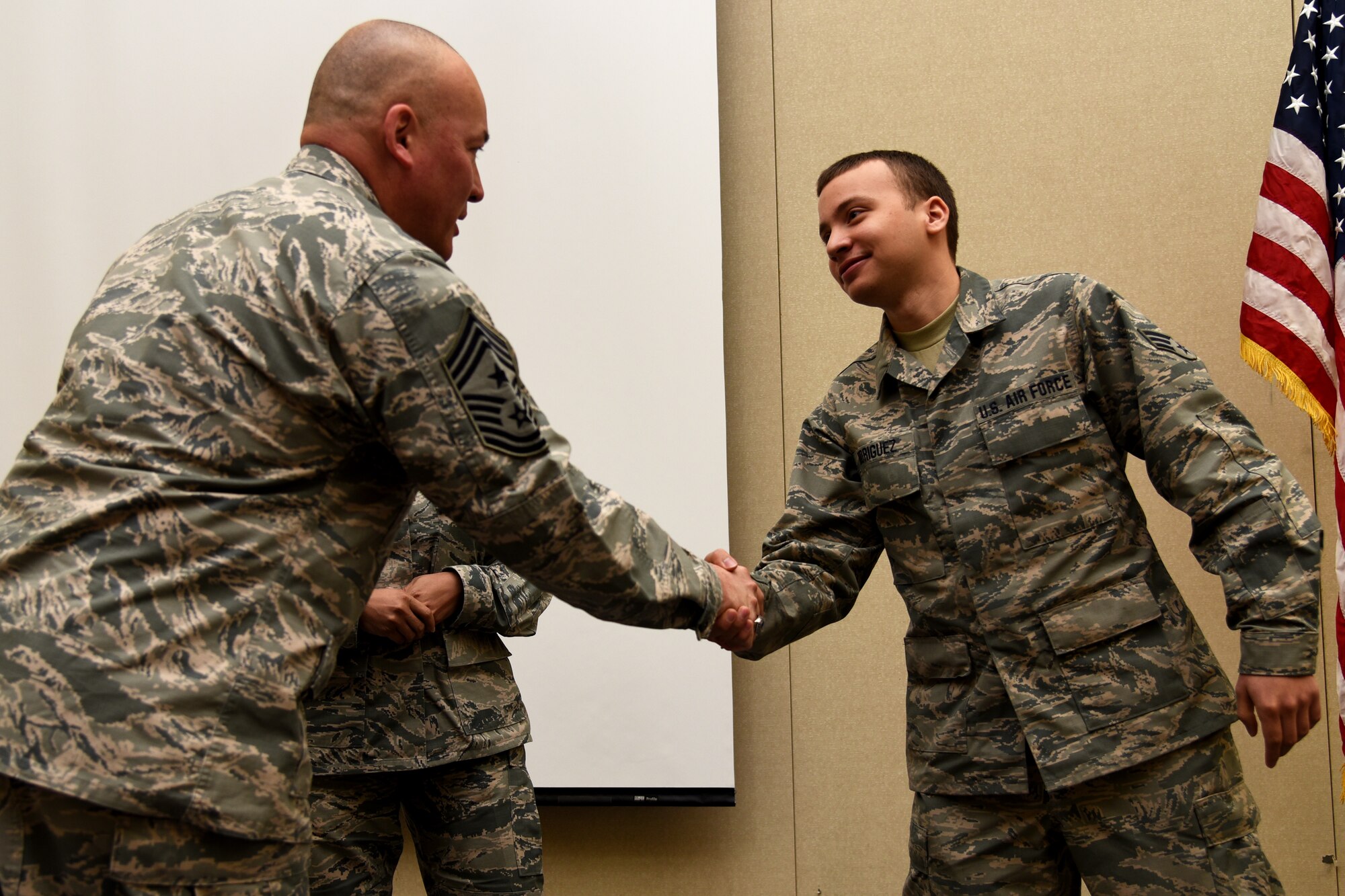 Chief Master Sgt. Mitchell O. Brush, the Senior Enlisted Advisor of the National Guard Bureau, coined Senior Airman Edwin Rodriguez, Jr., 108th Logistic Readiness Squadron, for his outstanding military service to the 108th Wing at the Joint Training and Training Development Center in Joint Base McGuire-Dix-Lakehurst, New Jersey, March 20, 2016. As the top noncommissioned officer of NGB, Brush advises the Chief, National Guard Bureau on all enlisted matters affecting training, effective utilization, the health of the force, and professional development for the National Guard. (U.S. Air National Guard photo by Tech. Sgt. Armando Vasquez/Released)