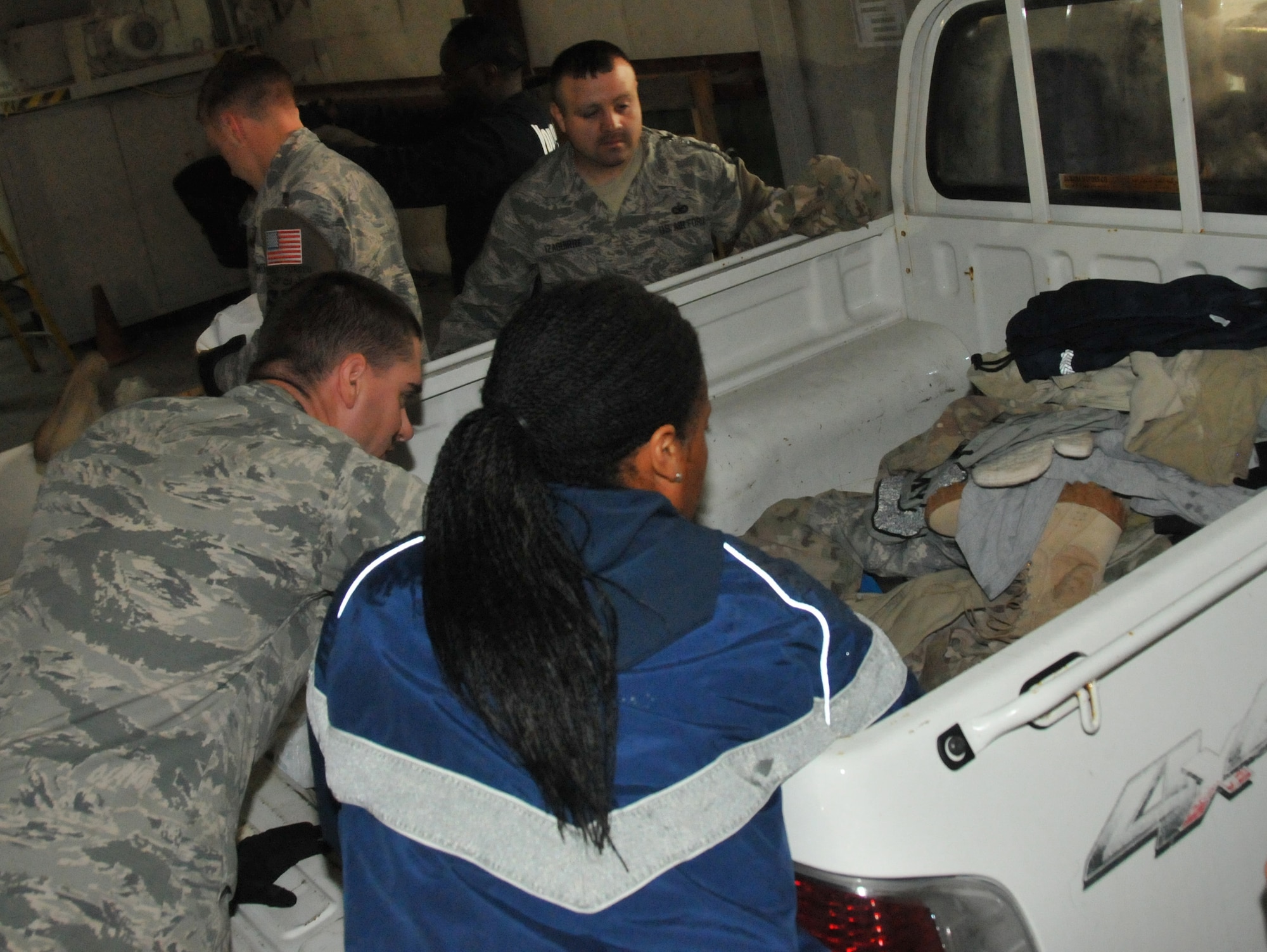 Uniform Disposal Program volunteers find serviceable uniforms inside some of the bins at Al Udeid Air Base, Qatar. If uniforms can be salvaged they are donated to the Airman’s Attic on base. (U.S. Air Force photo by Tech. Sgt. Terrica Y. Jones)