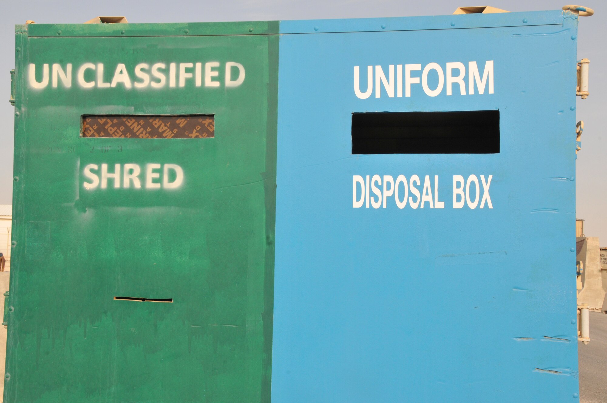 There are 15 uniform disposal bins at Al Udeid Air Base, Qatar. Four of the 15 bins located on base are combined bins for both uniforms and paper. Personnel should ensure they place the correct items in the specifically labeled bin. (U.S. Air Force photo by Tech. Sgt. Terrica Y. Jones)