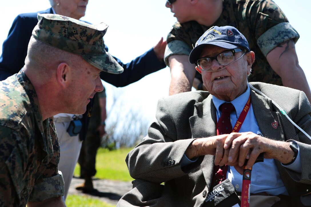 Marine Corps Col. Sean M. McBride, commander of the 3rd Marine Expeditionary Force, Headquarters Group, left, talks with Abraham Eutsey, a Marine Corps veteran of Iwo Jima, before the commencement of the 71st Commemoration of the Battle of Iwo Jima at Iwo To, Japan, March 19, 2016. Marine Corps photo by Lance Cpl. Juan Esqueda