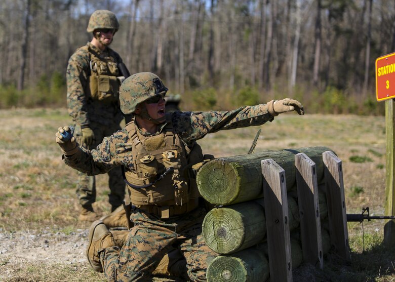 Lance Cpl. Evan D. Deniston, a military policeman with 2nd Law Enforcement Battalion, throws a dummy grenade, a non-exploding practice tool, during an assault course at Camp Lejeune, N.C., March 16, 2016. This drill is part of an annual training event to prepare them for combat situations when they are called upon to deploy. Marines took turns providing cover fire for their partner, allowing them to throw a dummy grenade near the simulated enemy position (U.S. Marine Corps photo by Lance Cpl. Aaron K. Fiala/Released)