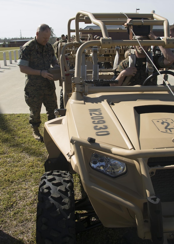 Commandant of the Marine Corps Gen. Robert B. Neller prepares to ride in a MRZR 4, a light tactical all-terrain vehicle, during his visit to U.S. Marine Corps Forces, Special Operations Command (MARSOC), at Stone Bay aboard Marine Corps Base Camp Lejeune, N.C., March 17, 2016. 