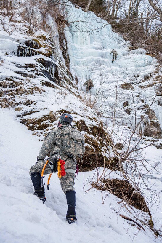 Soldiers ascend and descend routes on an ice wall during top rope training at Smuggler's Notch, Jeffersonville, Vt., March 5, 2016. Vermont Army National Guard photo by Staff Sgt. Chelsea Clark