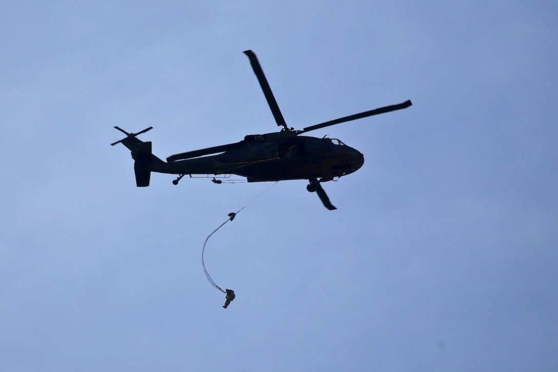 A paratrooper jumps from a UH-60 Black Hawk helicopter during a parachute jump over Coyle drop zone on Joint Base McGuire-Dix-Lakehurst, N.J., March 12, 2016. New Jersey Air National Guard photo by Tech. Sgt. Matt Hecht