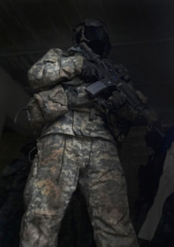 A soldier provides security after conducting a search of a building during urban terrain training on Fort Hood, Texas, March 10, 2016. Army photo by Sgt. Brandon Banzhaf