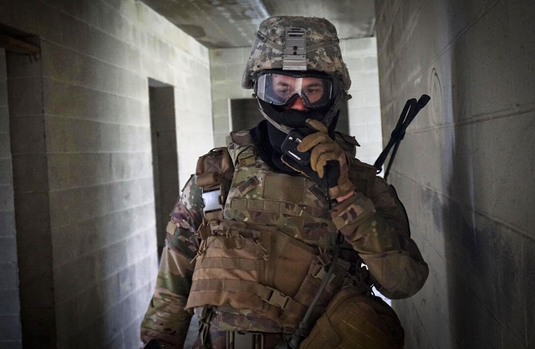 A soldier radios a situation report during urban terrain training on Fort Hood, Texas, March 10, 2016. Army photo by Sgt. Brandon Banzhaf