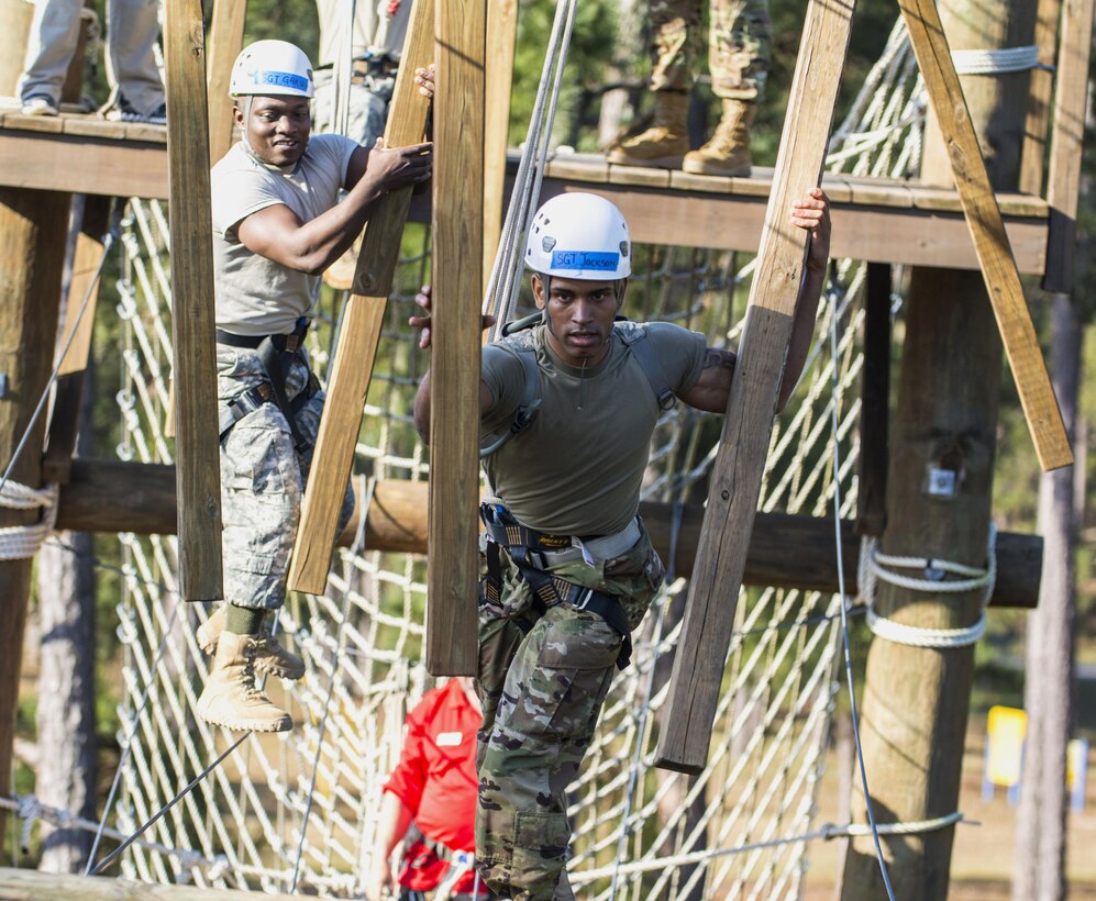 Army Sgt. Marcus Jackson, foreground, negotiates a 30-foot high obstacle during a team building exercise that's part of the Army Reserve Medical Command's 2016 Best Warrior competition on Fort Gordon, Ga., March 8, 2016. Jackson is assigned to the Southeastern Medical Area Readiness Support Group, Army Reserve Medical Command. Army photo by Sgt. 1st Class Brian Hamilton
