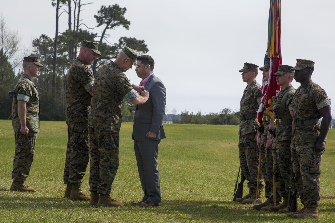 Maj. Gen. Brian Beaudreault, commanding general of 2nd Marine Division, pins a Silver Star Medal on Sgt. Matthew Parker (ret.) at Camp Lejeune, N.C., March 18, 2016. Parker was awarded the Silver Star for his courageous actions during Operation Enduring Freedom in 2011, where he assumed control of his platoon during a firefight after several leaders had been injured. (U.S. Marine Corps photo by Sgt. Kirstin Merrimarahajara/released)