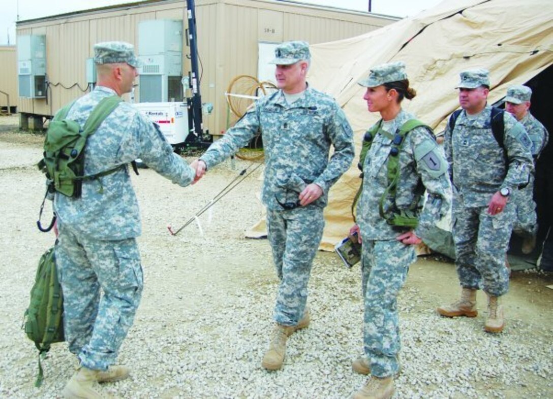 Sgt. Major of the Army Raymond Chandler III, center, greets Command Sgt. Maj. John Morales, left, the senior enlisted advisor to the commander of the 2nd Battalion, 2nd Infantry Regiment, and Command Sgt. Maj. Billie Jo Boersma, right, the senior enlisted advisor to the commander of the 3rd Brigade Special Troops Battalion, during a visit to the Joint Readiness Training Center at Fort Polk, La., Feb. 21, 2013. Army photo by Jeff England
