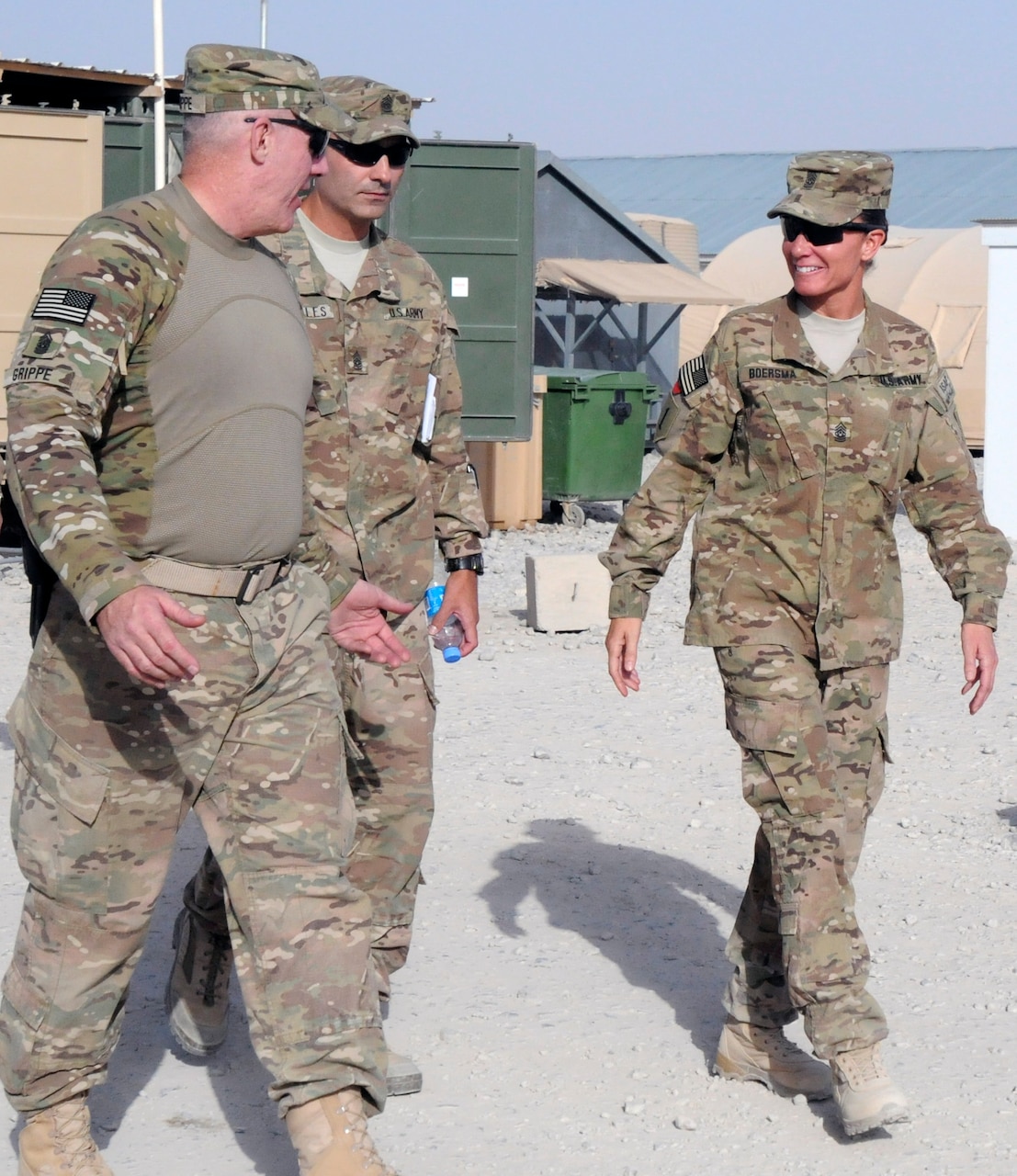 Army Command Sgt. Maj. Frank Grippe, the senior noncommissioned officer for U.S. Central Command, accompanies Army Command Sgt. Maj. John Morales, the senior noncommissioned officer for the 2nd Battalion, 2nd Infantry Regiment, and Command Sgt. Maj. Billie Jo Boersma, the senior noncommissioned officer for the 3rd Infantry Brigade Combat Team, to dinner at Forward Operating Base Apache, Afghanistan, July 23, 2013. Army photo by Sgt. Kandi Huggins